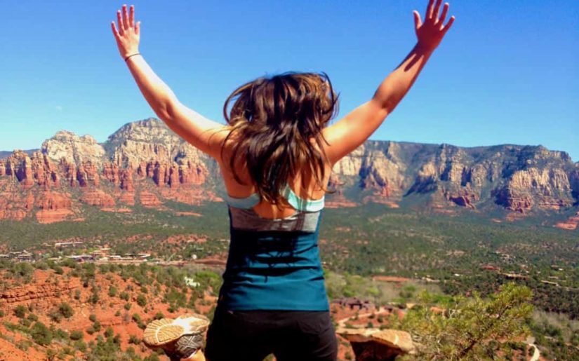 Campfire Collective Ambassador Elizabeth R jumping in the air at Sedona, Arizona.