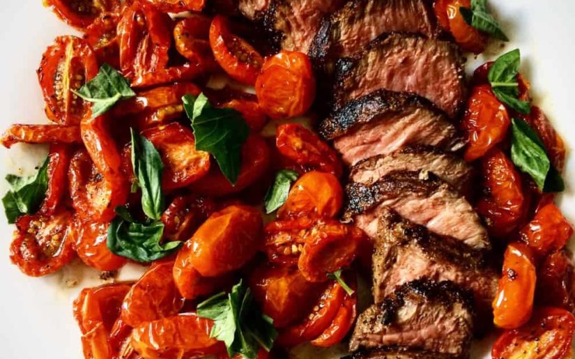 Wild venison tenderloin medallions cooked with baby tomatoes and bay leaves.