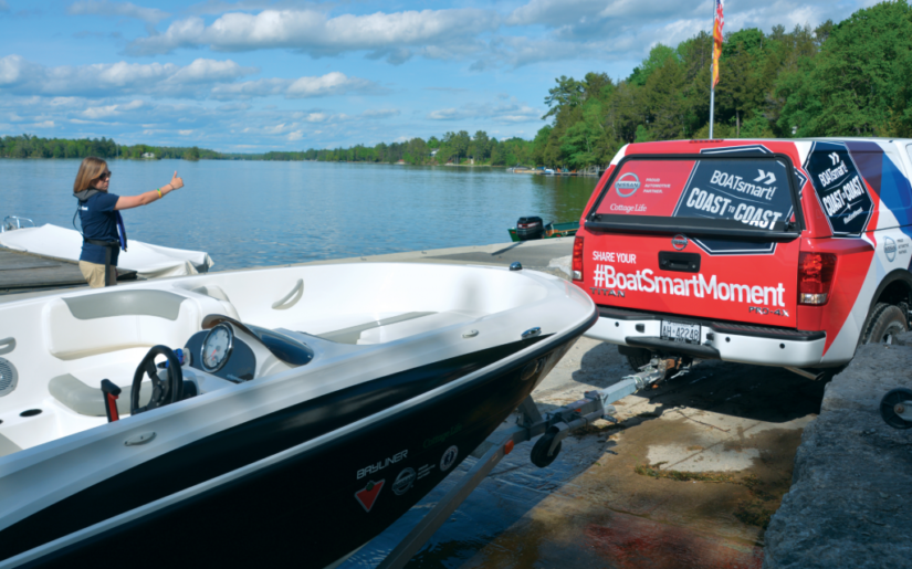 BOATsmart! Nissan Titan backing up Bayliner boat down boatlaunch ramp.