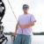 Campfire Collective Wakesurfing Ambassador Keenan Flegel holding dock line attached to wakeboard boat.
