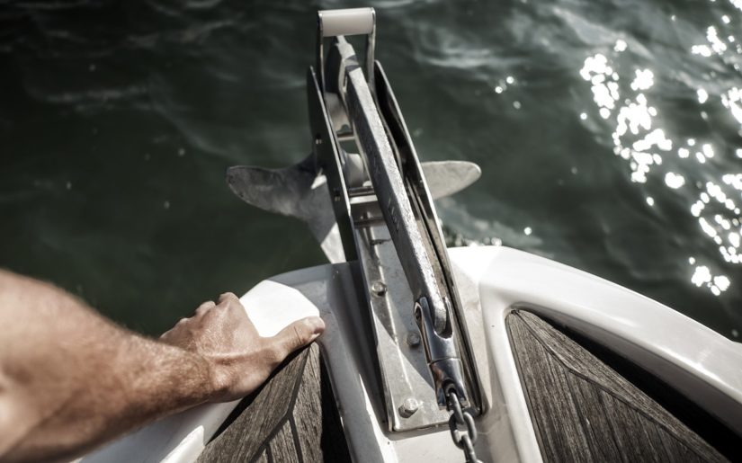 Preparing to drop anchor from the bow of a boat.