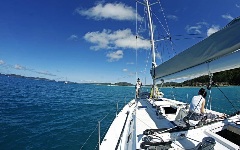 Sailboat setting sail after properly preparing for the trip.