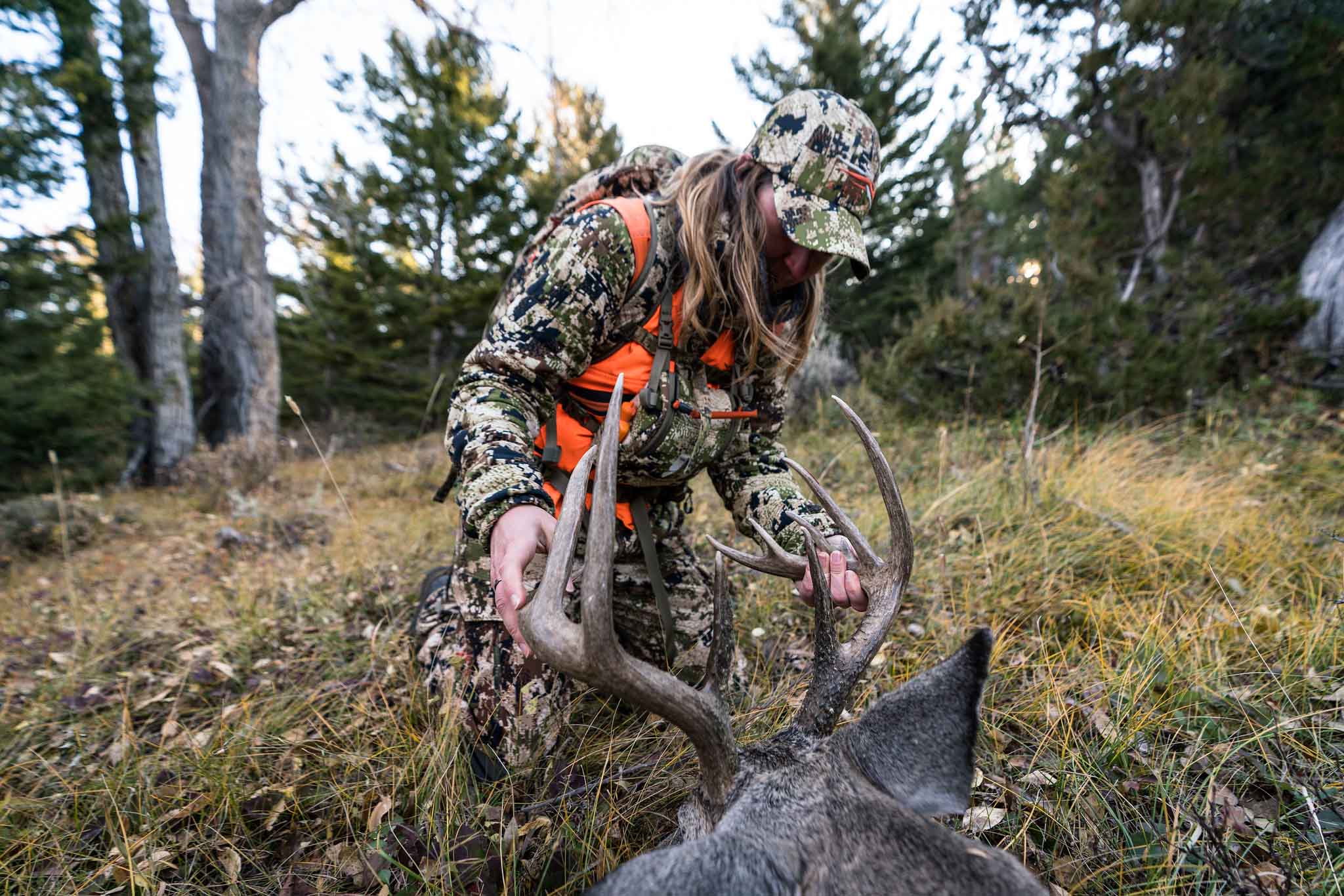 Hunter holding the rack of his harvest